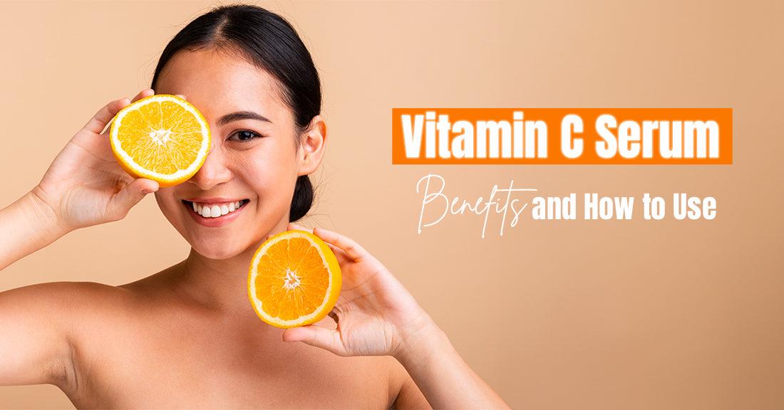 Woman holding a sliced orange with smiling face, next to text: ‘Vitamin C Serum Benefits and How to Use’