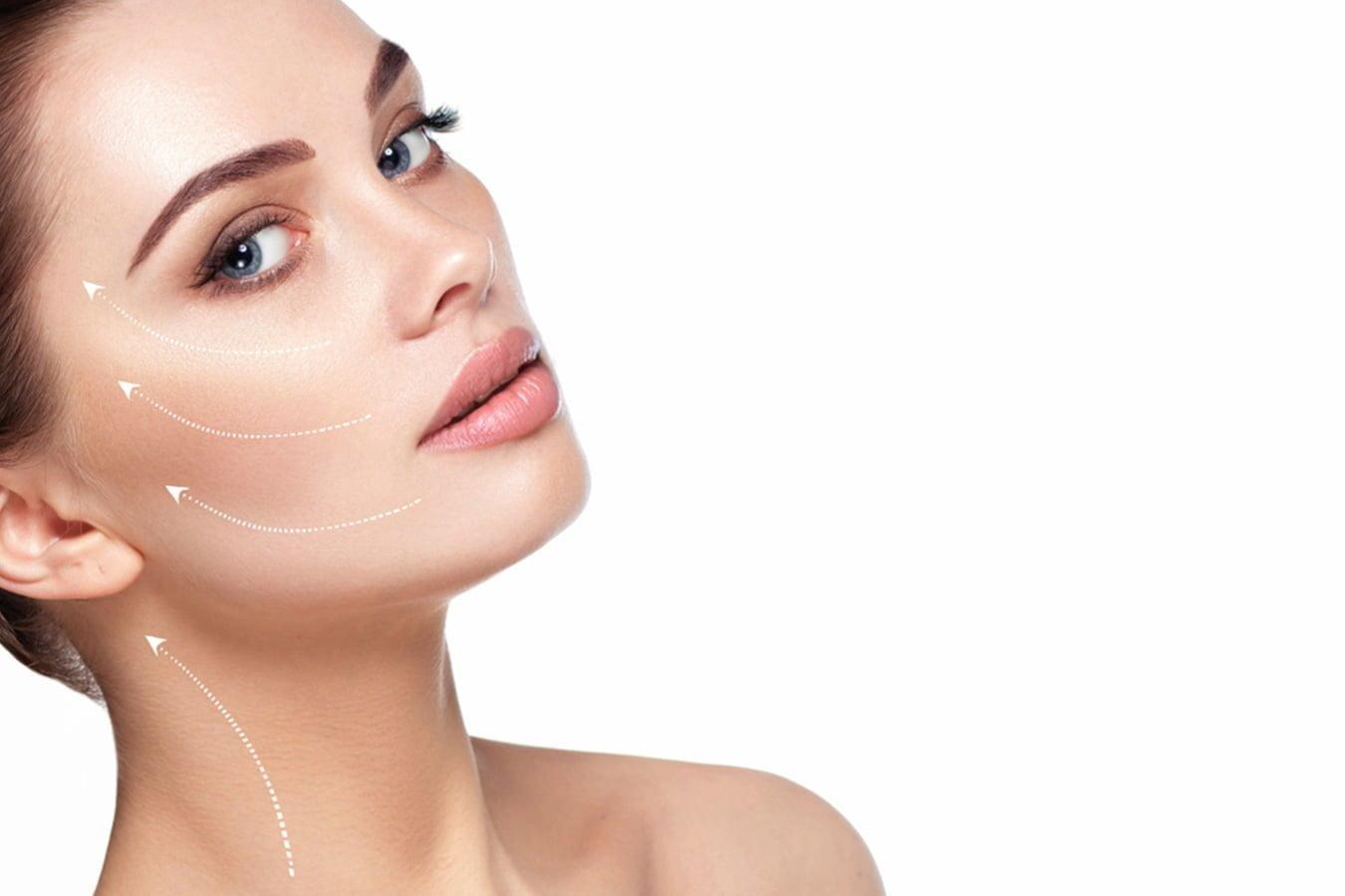 Close-up of woman with clear skin, beauty arrows highlighting facial contour, skincare concept